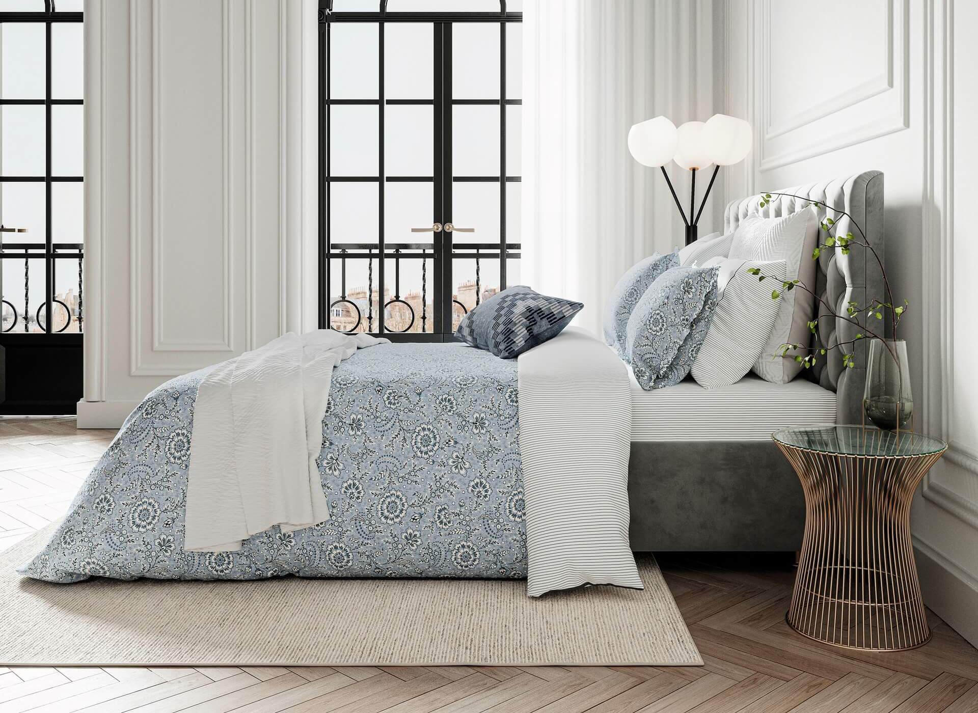 a bed sitting in a bedroom next to a window