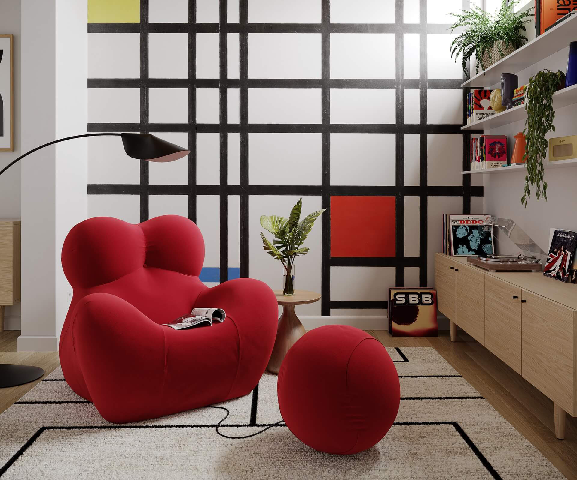 a living room with a red chair and a black and white wall